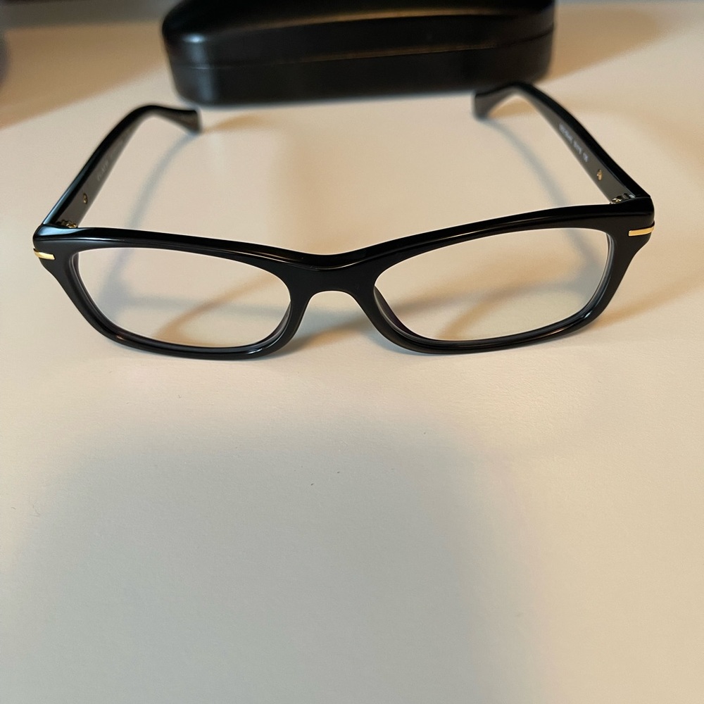 Authentic Coach glasses, black frame with gold logo.